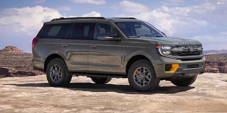 A photo of a 2025 Ford Expedition parked on a rocky outcropping. 